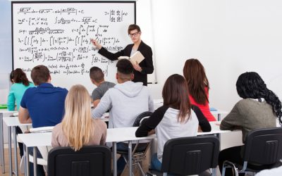 man-teaching-mathematics-to-class-of-students